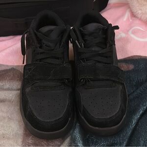 All black Travis Scott sneakers